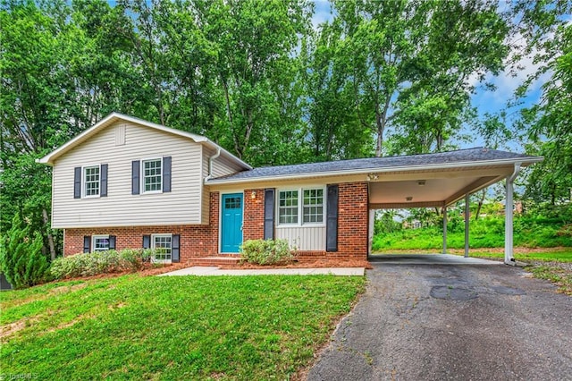 911 Chuppway Ct, Winston-Salem, NC 27106 - tri-level home with asphalt driveway, a front yard, brick siding, and an attached carport