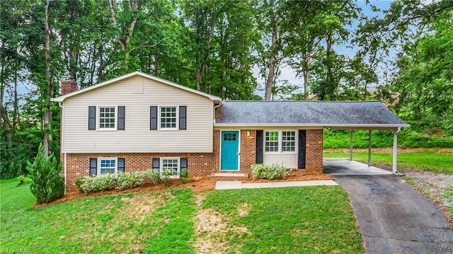 911 Chuppway Ct, Winston-Salem, NC 27106 - tri-level home featuring driveway, a front lawn, a chimney, brick siding, and an attached carport