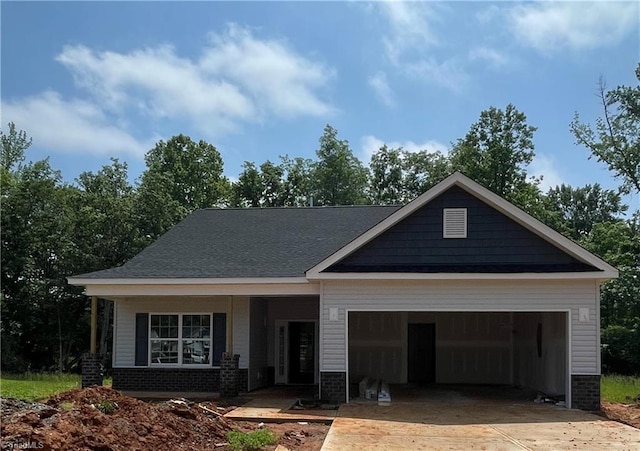 1998 Meadowview Dr Lot 8, Graham, NC 27253 - craftsman house with concrete driveway, an attached garage, and brick siding