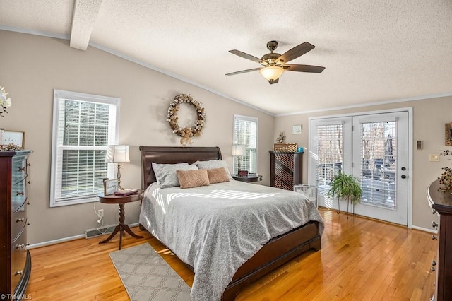 bedroom with access to exterior, vaulted ceiling with beams, multiple windows, and ceiling fan