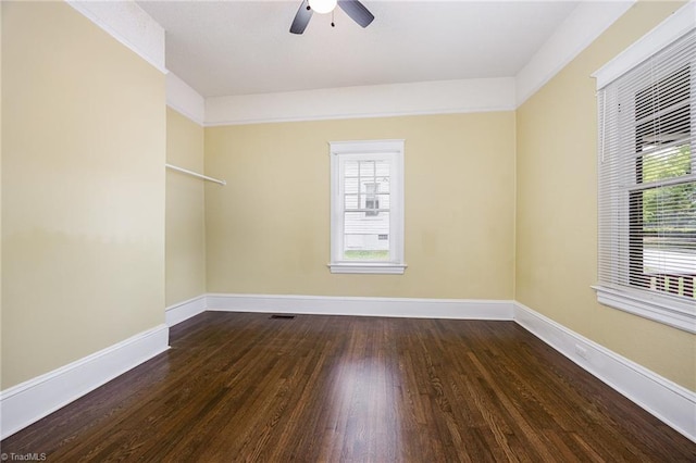unfurnished room featuring wood finished floors, ceiling fan, and baseboards