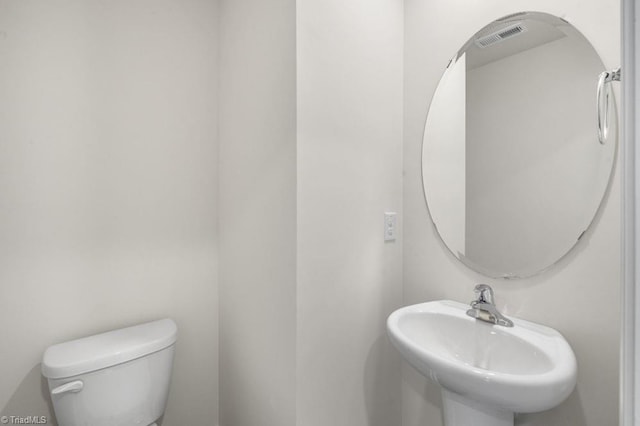 bathroom with sink and toilet