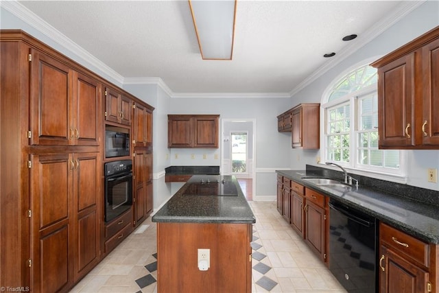 kitchen featuring dark stone counters, a sink, crown molding, black appliances, and a kitchen island