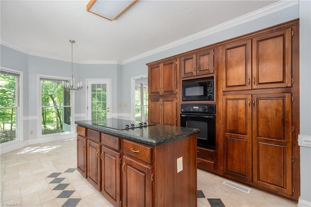 kitchen featuring black appliances, an inviting chandelier, crown molding, and a kitchen island