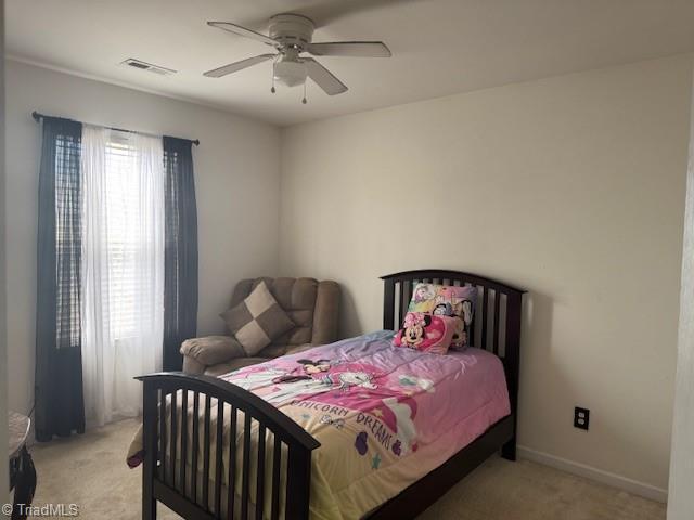 carpeted bedroom with ceiling fan