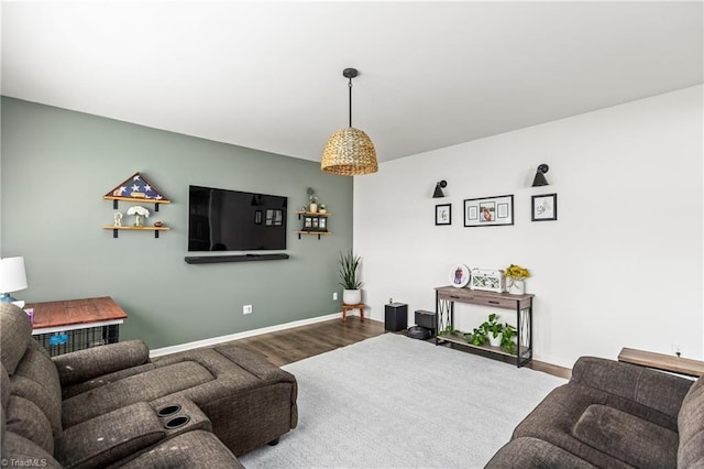living room featuring baseboards and wood finished floors