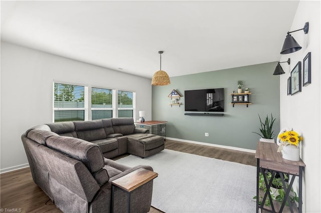 living room featuring baseboards and wood finished floors