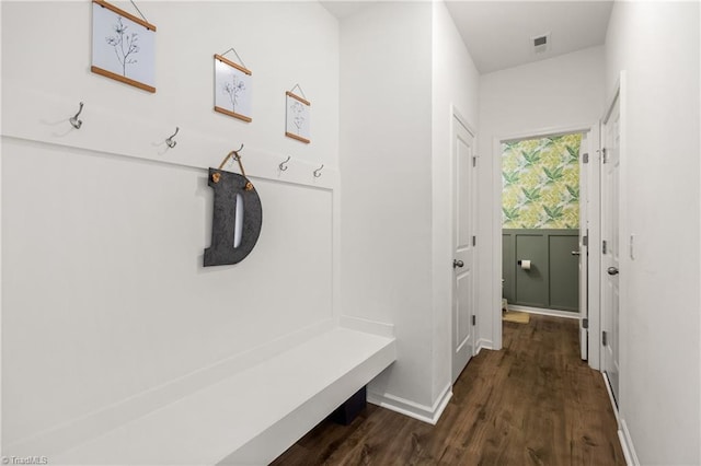 mudroom featuring baseboards, dark wood finished floors, and visible vents