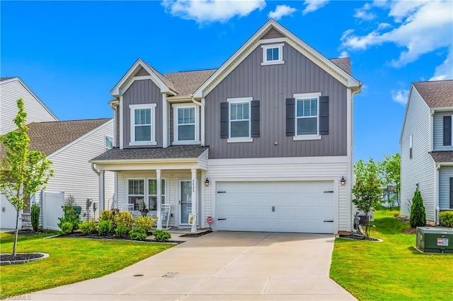 view of front of property with a garage, board and batten siding, a porch, a front yard, and concrete driveway