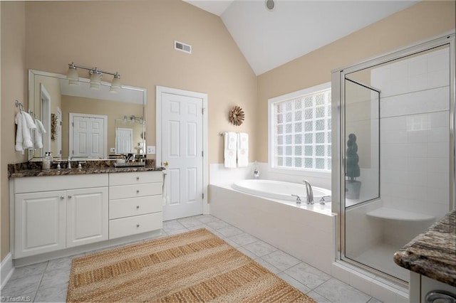 full bath featuring tile patterned floors, visible vents, lofted ceiling, and a shower stall