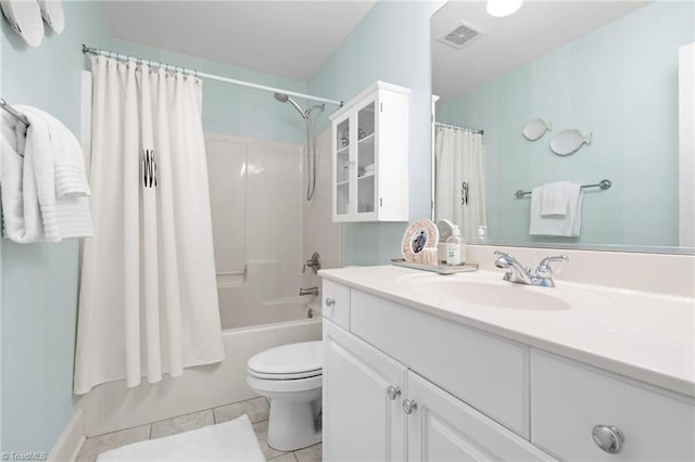 bathroom featuring tile patterned flooring, visible vents, toilet, shower / tub combo, and vanity