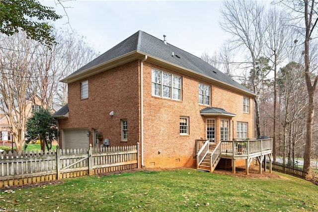 back of property featuring brick siding, fence, a wooden deck, a garage, and crawl space