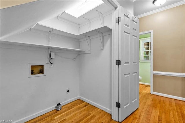laundry room featuring washer hookup, laundry area, electric dryer hookup, light wood-type flooring, and baseboards