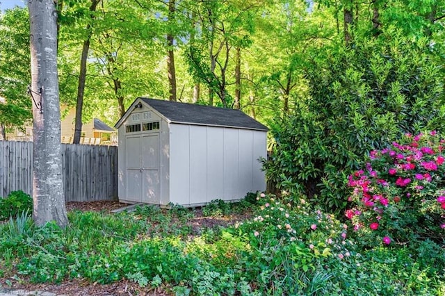 view of shed with fence