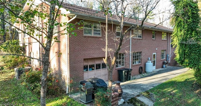 back of house featuring a garage