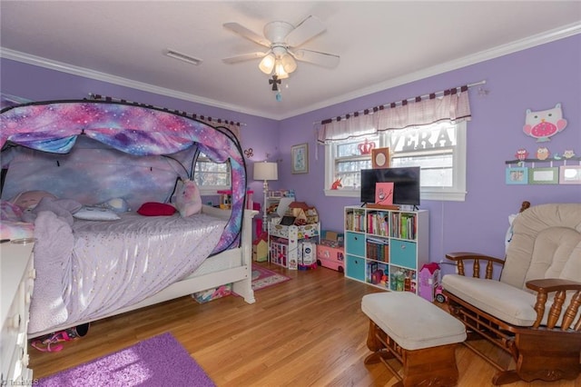 7715 W NC Highway 268, Wilkesboro, NC 28697 - bedroom with wood finished floors, ornamental molding, and a ceiling fan