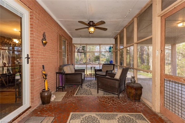 7715 W NC Highway 268, Wilkesboro, NC 28697 - sunroom / solarium featuring ceiling fan, healthy amount of natural light, outdoor lounge area, and brick wall