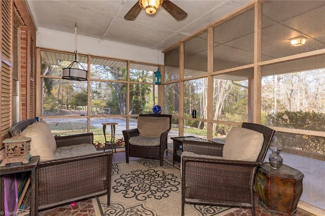 sunroom / solarium featuring ceiling fan