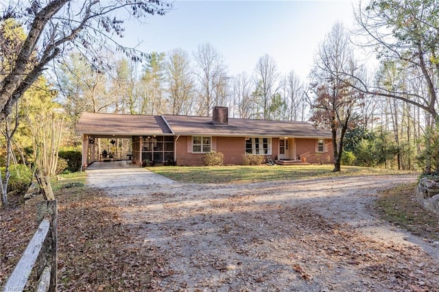 7715 W NC Highway 268, Wilkesboro, NC 28697 - ranch-style home featuring driveway, a chimney, a carport, and a front lawn