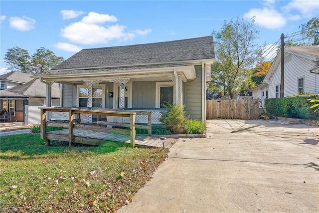 bungalow-style home with a porch and a front yard