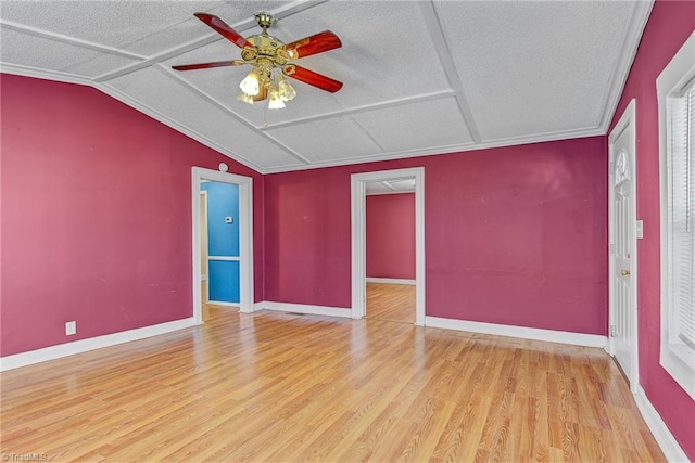 empty room featuring light hardwood / wood-style floors, crown molding, a textured ceiling, and ceiling fan