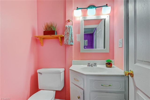 bathroom with vanity and toilet