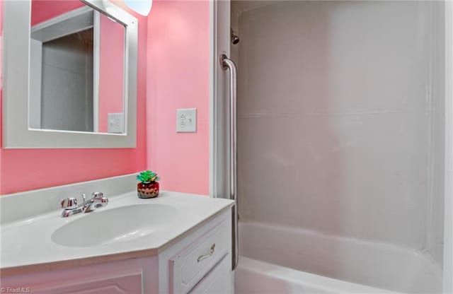 bathroom with shower / bath combination and vanity