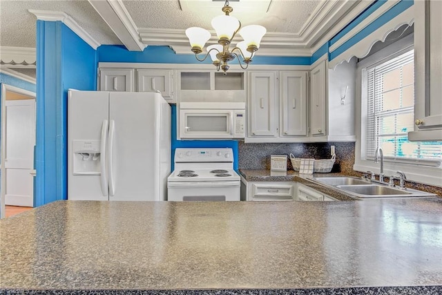 kitchen featuring a chandelier, white appliances, backsplash, sink, and ornamental molding