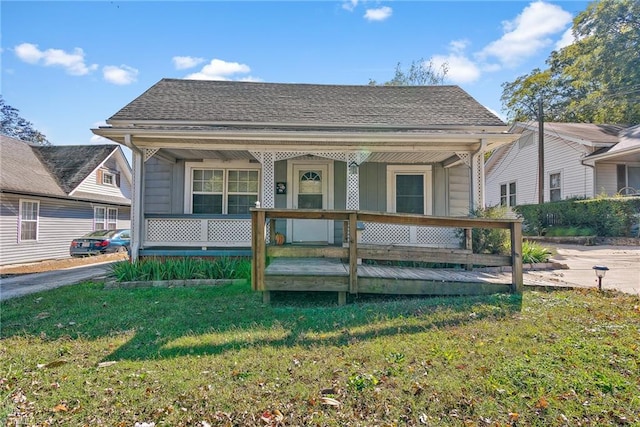 bungalow featuring a front yard