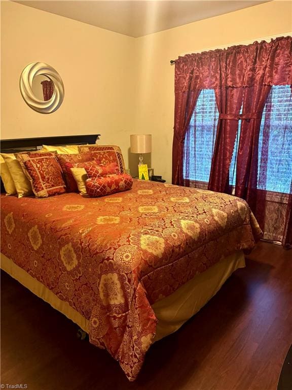 bedroom featuring hardwood / wood-style flooring