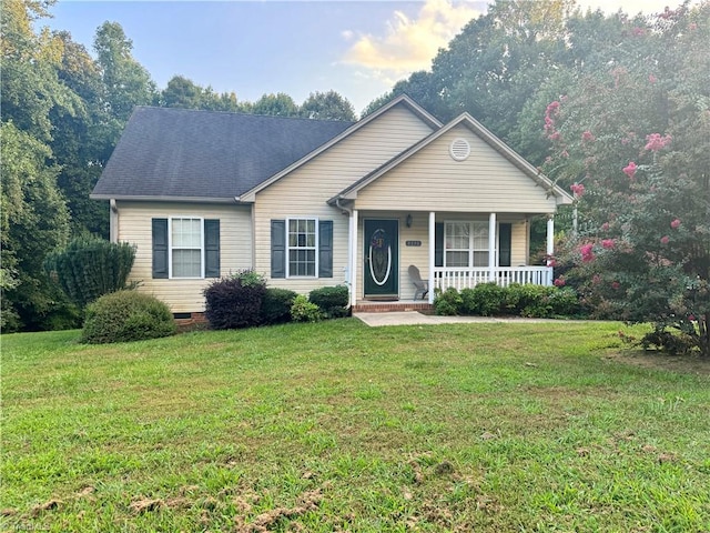 view of front of home with covered porch and a front yard