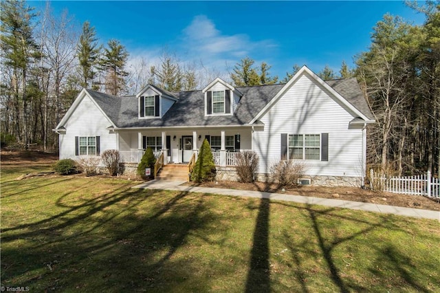 cape cod-style house featuring fence, a porch, and a front yard