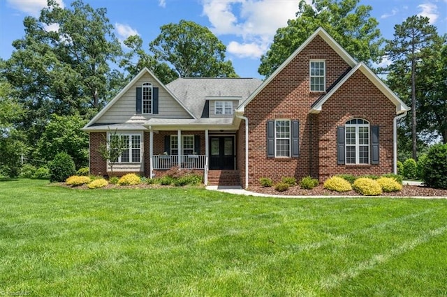 320 N Club Dr, Asheboro, NC 27205 - view of front of home with a porch, a front yard, and brick siding