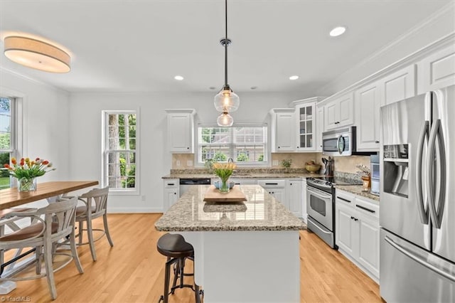 320 N Club Dr, Asheboro, NC 27205 - kitchen featuring stainless steel appliances, white cabinets, a kitchen breakfast bar, light wood finished floors, and recessed lighting