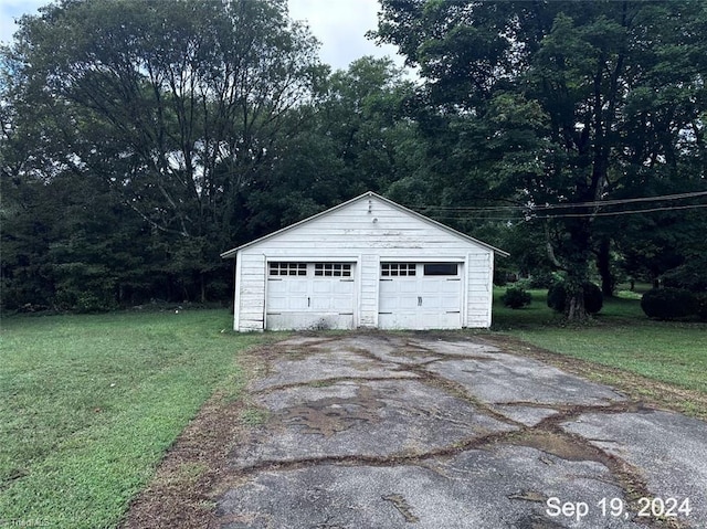 garage featuring a yard