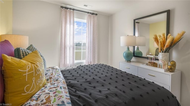 bedroom featuring visible vents