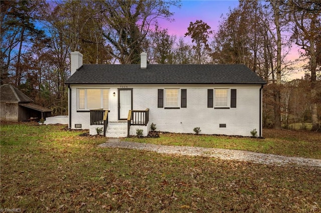 view of front of property with a yard