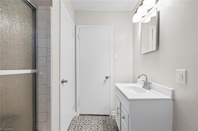 bathroom with vanity and an enclosed shower