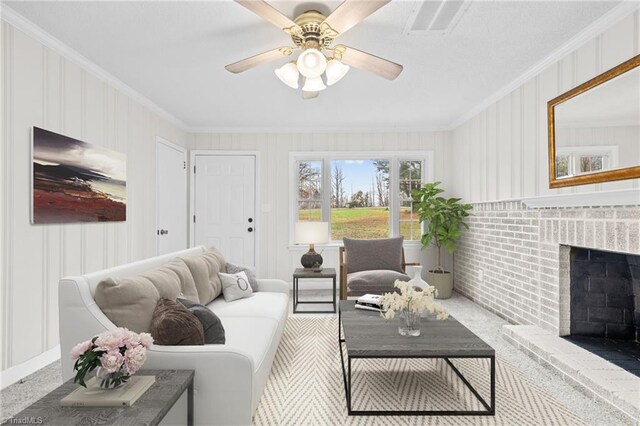 carpeted living room featuring ceiling fan, crown molding, and a brick fireplace