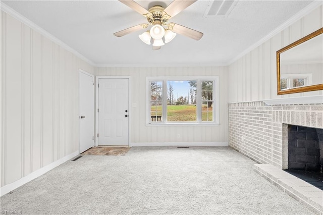 unfurnished living room with ceiling fan, a fireplace, ornamental molding, and carpet floors