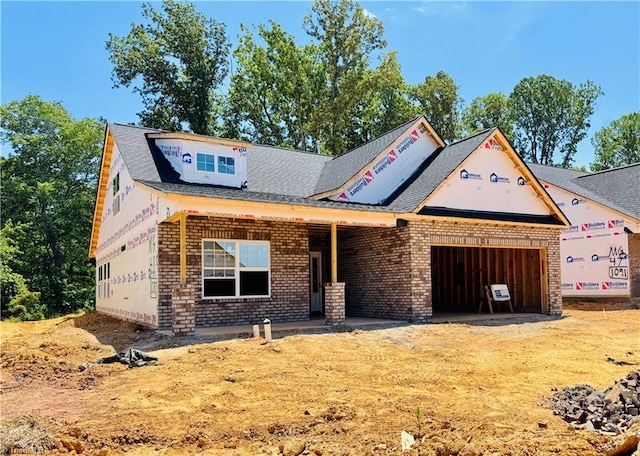 1087 Fairhaven Dr Lot 48, Mebane, NC 27302 - property in mid-construction featuring brick siding, an attached garage, and a shingled roof