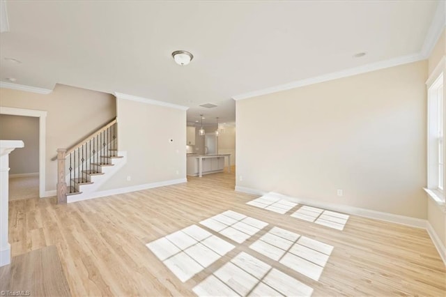 1087 Fairhaven Dr Lot 48, Mebane, NC 27302 - unfurnished living room featuring light wood-style floors, crown molding, stairway, and baseboards