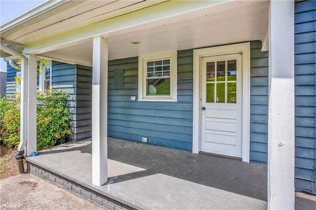 entrance to property with covered porch