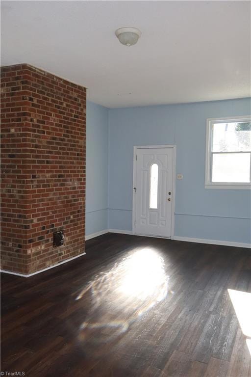 entrance foyer featuring dark hardwood / wood-style floors