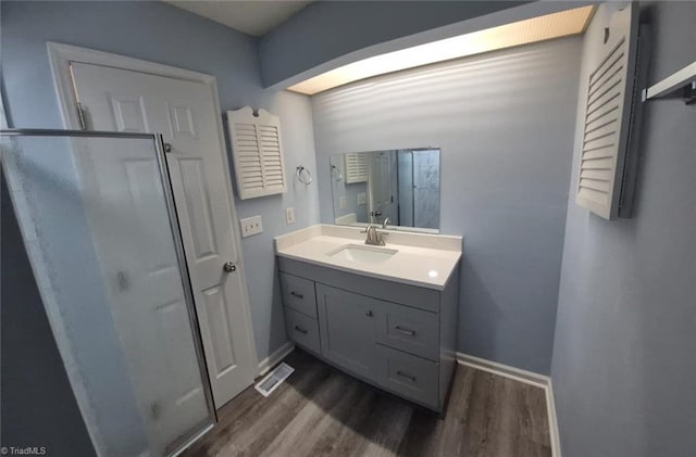 bathroom featuring hardwood / wood-style floors and vanity