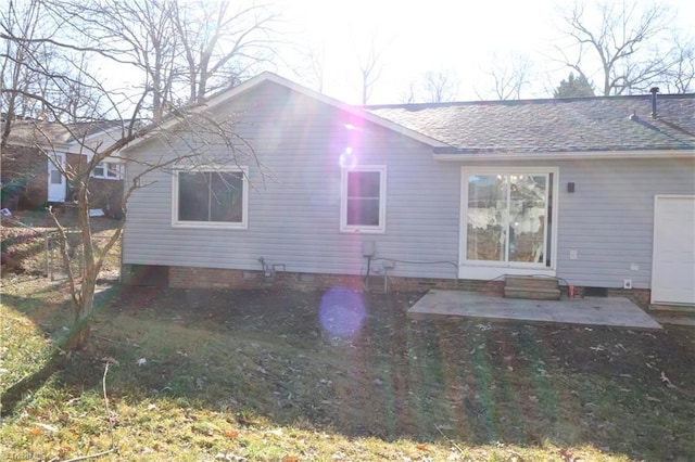 back of property with a patio