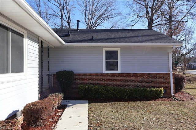 view of home's exterior with a lawn
