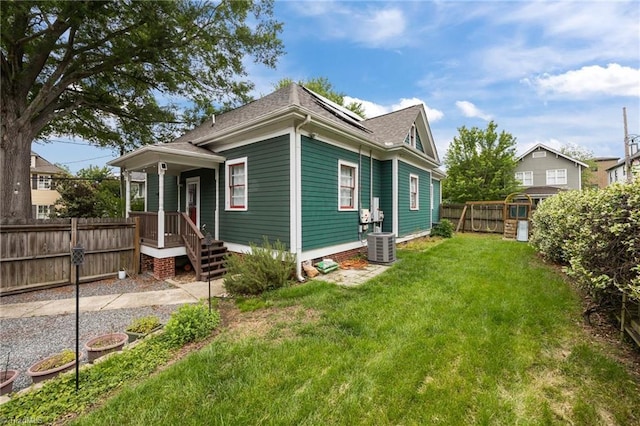420 Mcadoo Ave, Greensboro, NC 27406 - view of front of property with central air condition unit, roof with shingles, and solar panels