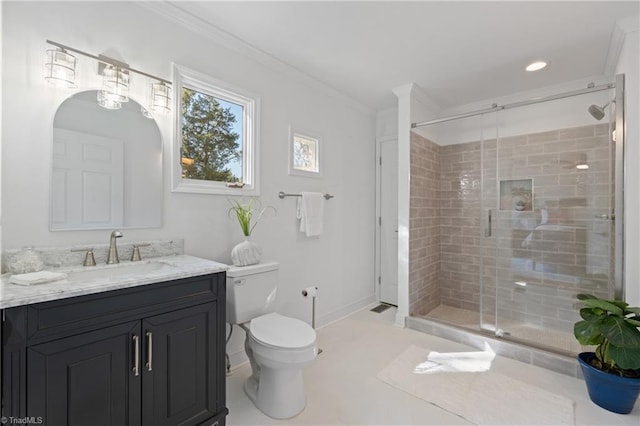 bathroom with an enclosed shower, ornamental molding, vanity, and toilet