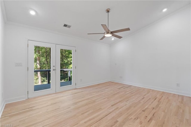 spare room with french doors, ornamental molding, light wood-type flooring, and ceiling fan